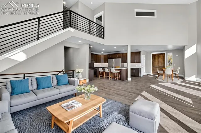 a spacious bedroom with a bed and a couch