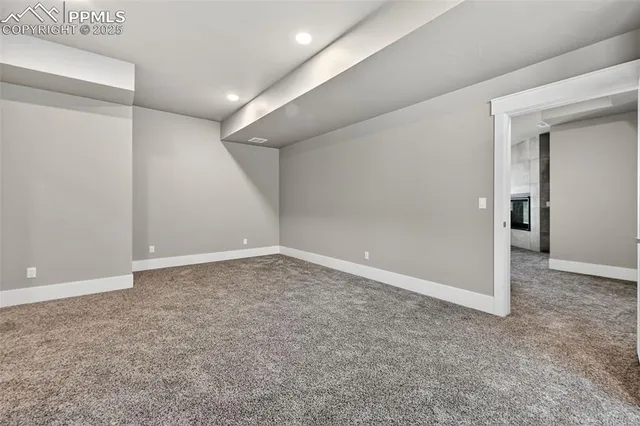 a spacious bathroom with a toilet sink and mirror