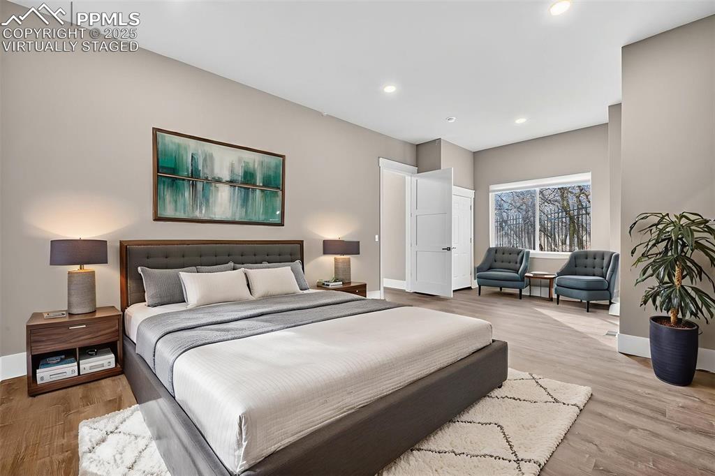 485 Cardiff Circle Colorado Springs, CO 80906 - Photo 5 of 50 a spacious bedroom with a bed and a couch