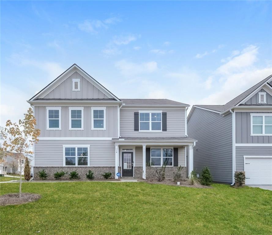 14 Canterbury Valley Braselton, GA 30517 - Photo 1 of 25 a front view of a house with a yard