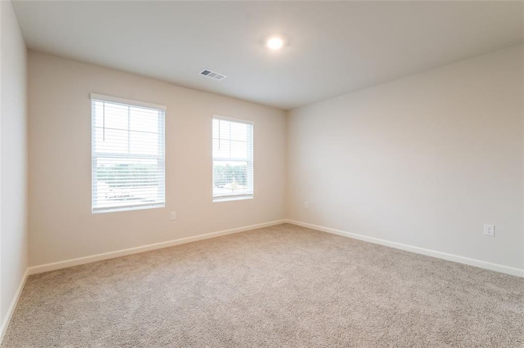 14 Canterbury Valley Braselton, GA 30517 - Photo 14 of 25 an empty room with windows