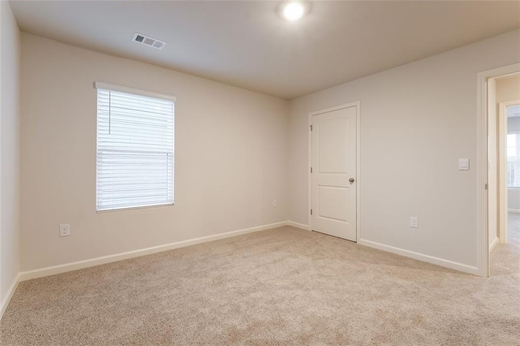 14 Canterbury Valley Braselton, GA 30517 - Photo 18 of 25 an empty room with a window