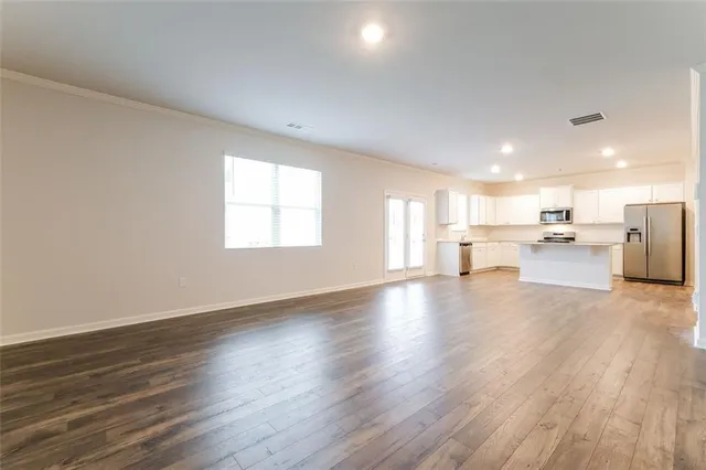 a view of a kitchen with a sink and a window