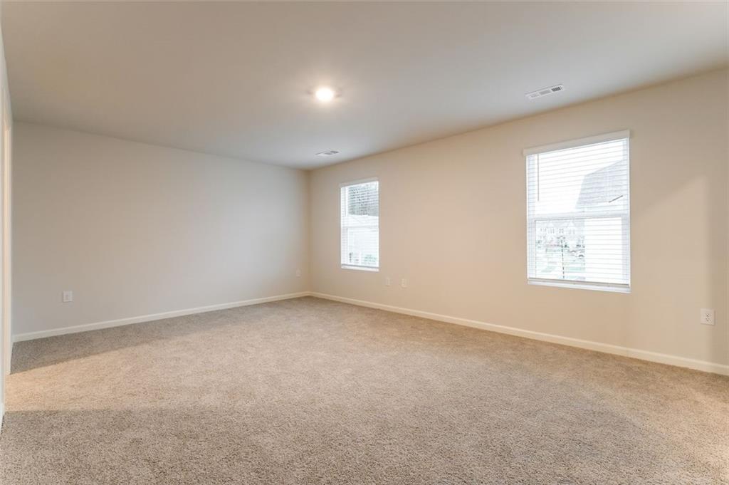 14 Canterbury Valley Braselton, GA 30517 - Photo 9 of 25 an empty room with windows