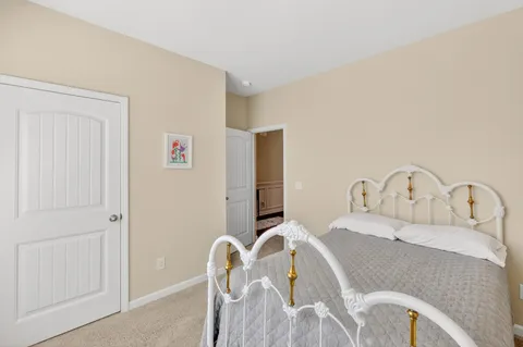 a bedroom with a bed and a table