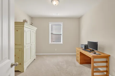 a view of a house with a street