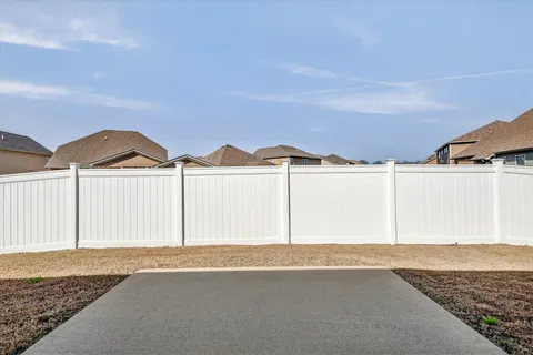 a view of a back yard of the house