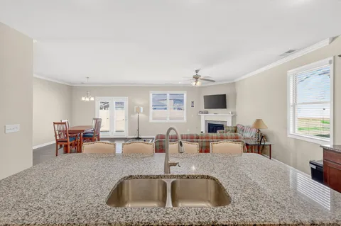 a kitchen with sink refrigerator and window