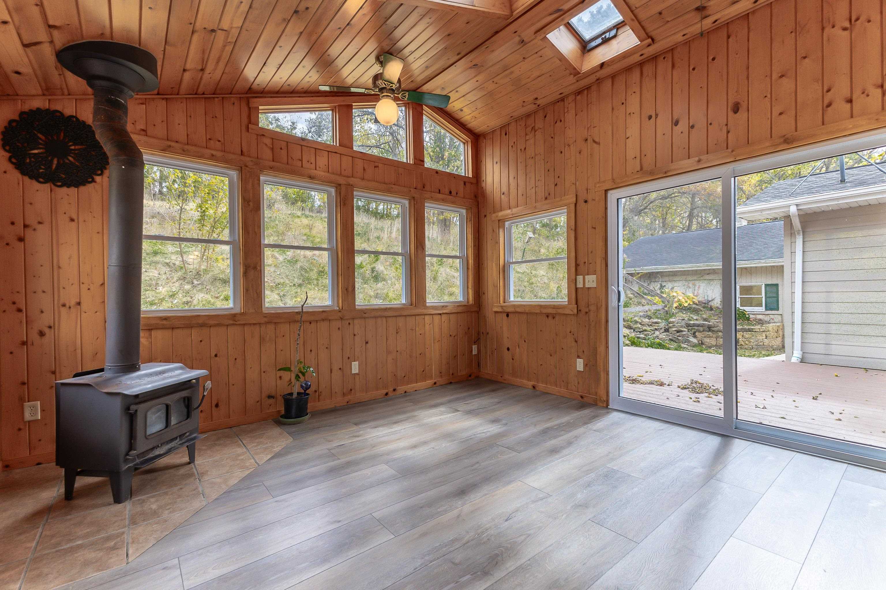 151 North Blackjack Road Galena, IL 61036 - Photo 15 of 65 a view of an empty room with a window and wooden floor
