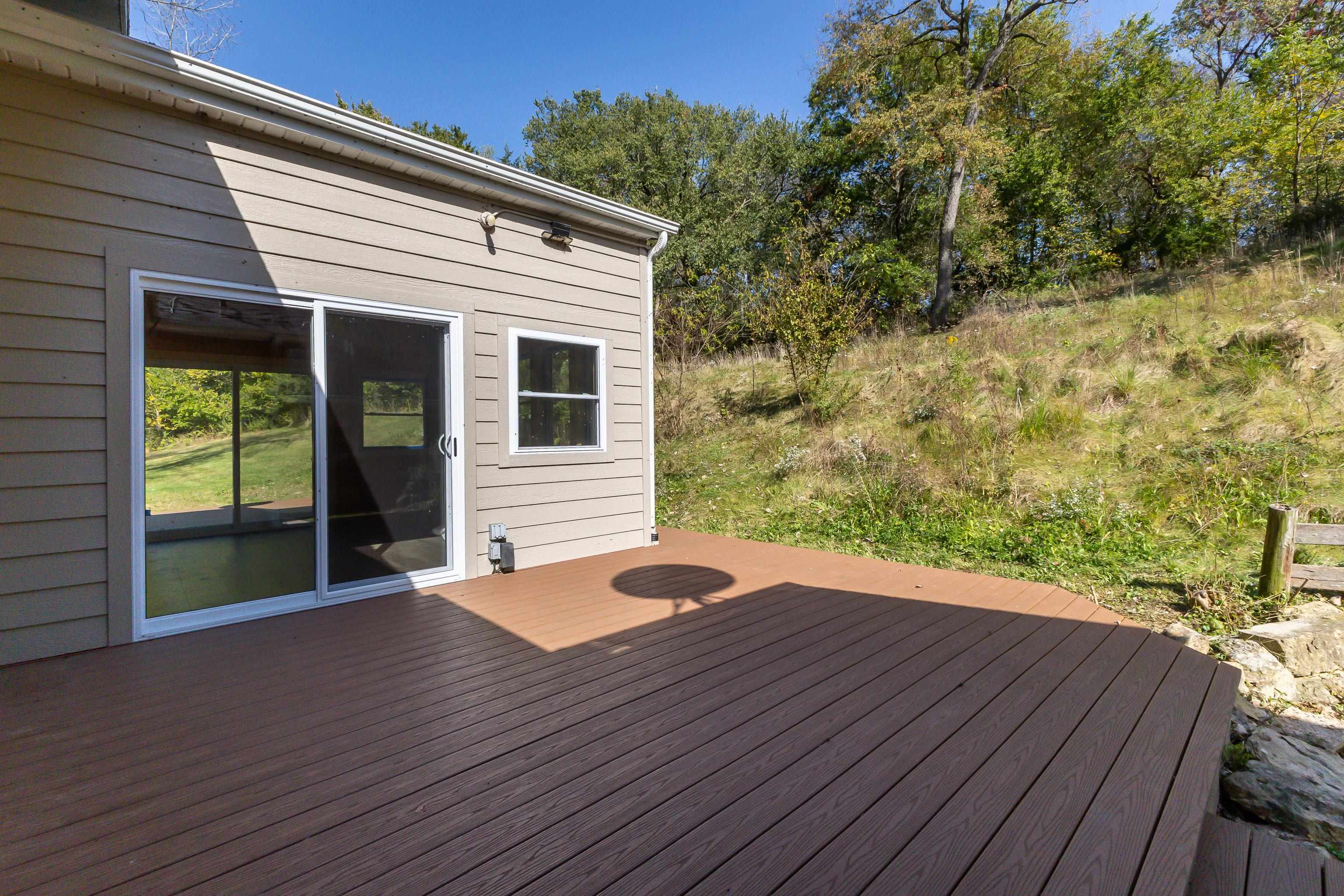 151 North Blackjack Road Galena, IL 61036 - Photo 20 of 65 a backyard of a house with seating space