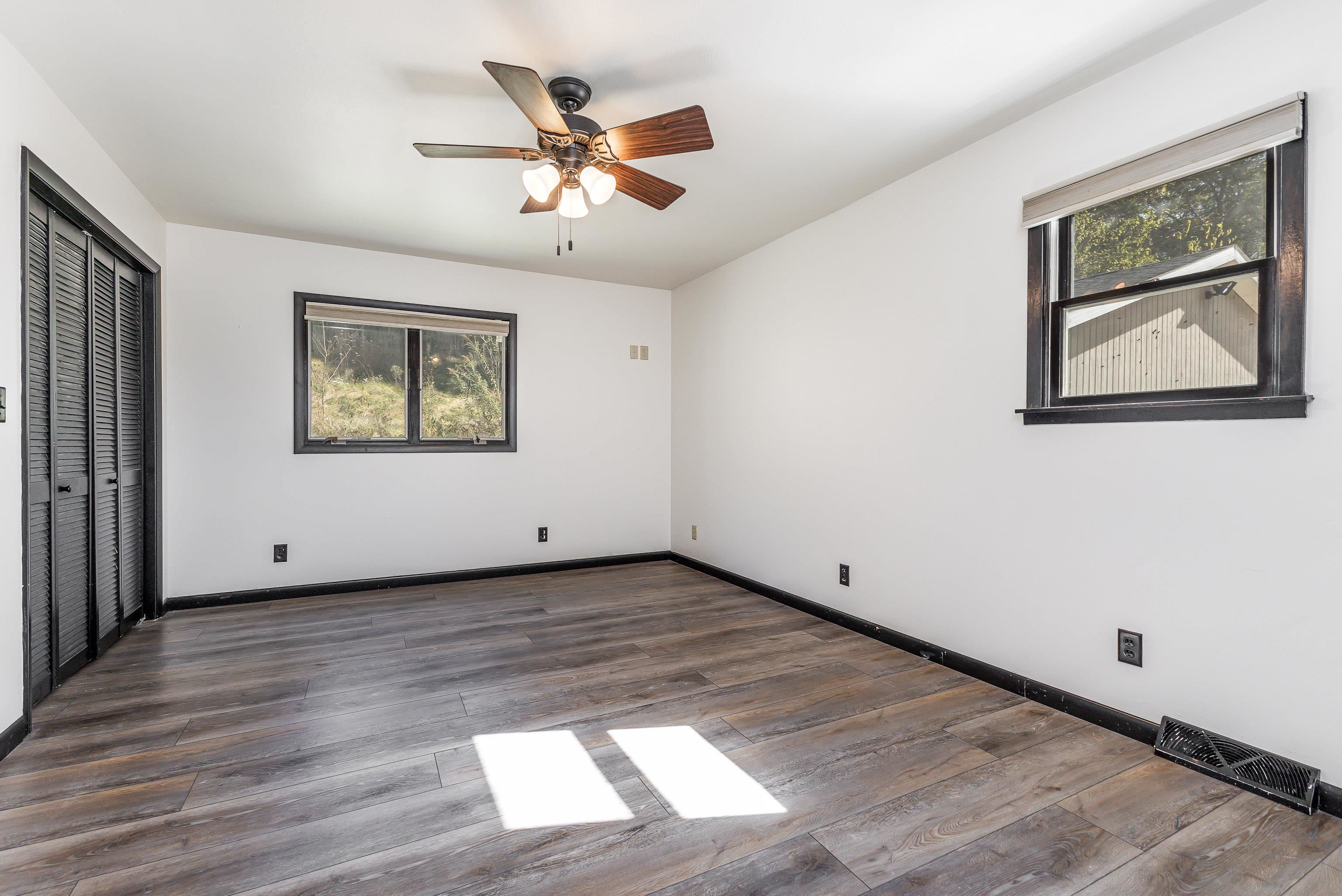 151 North Blackjack Road Galena, IL 61036 - Photo 27 of 65 a view of a big room with wooden floor and windows