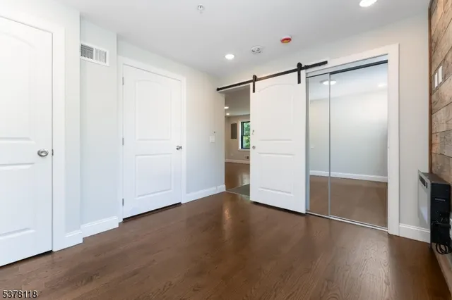 an empty room with wooden floor