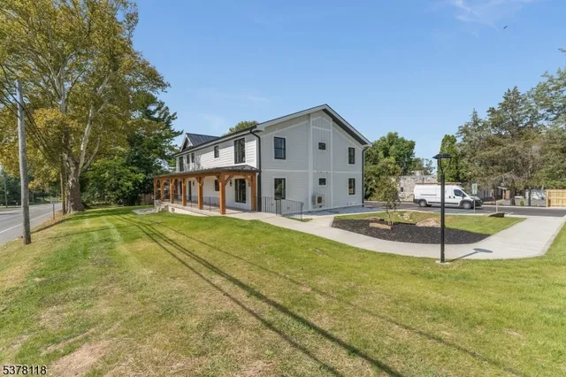 a view of a house with swimming pool and a yard