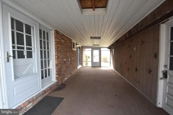 a view of empty room with windows