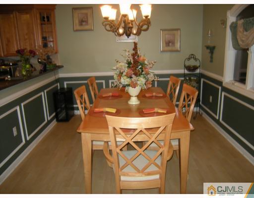 10 Sturgis Road Edison, NJ 08817 - Photo 6 of 9 a view of a dining room with furniture and wooden floor
