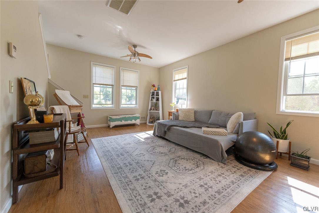 683 Easton Road, Unit AC Riegelsville, PA 18077 - Photo 7 of 27 a living room with furniture a wooden floor and a window