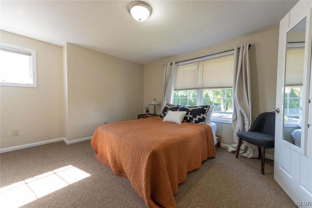 683 Easton Road, Unit AC Riegelsville, PA 18077 - Photo 8 of 27 a bed room with a bed and a chair