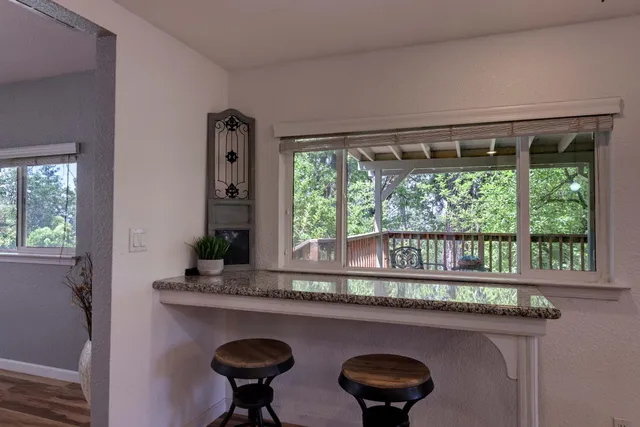 a kitchen with stainless steel appliances granite countertop a sink stove and cabinets
