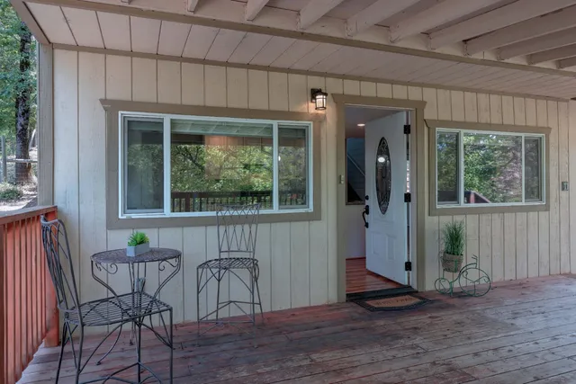 a view of a balcony with wooden floor