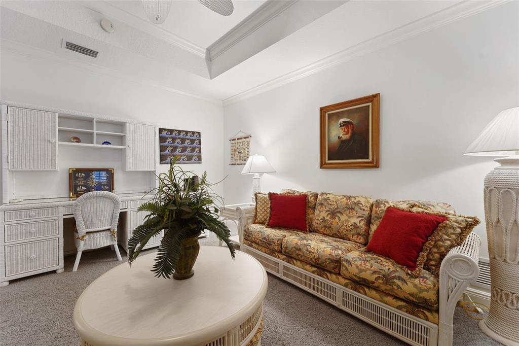 17735 Gulf Boulevard, Unit 702 Redington Shores, FL 33708 - Photo 18 of 60 a living room with furniture and a potted plant