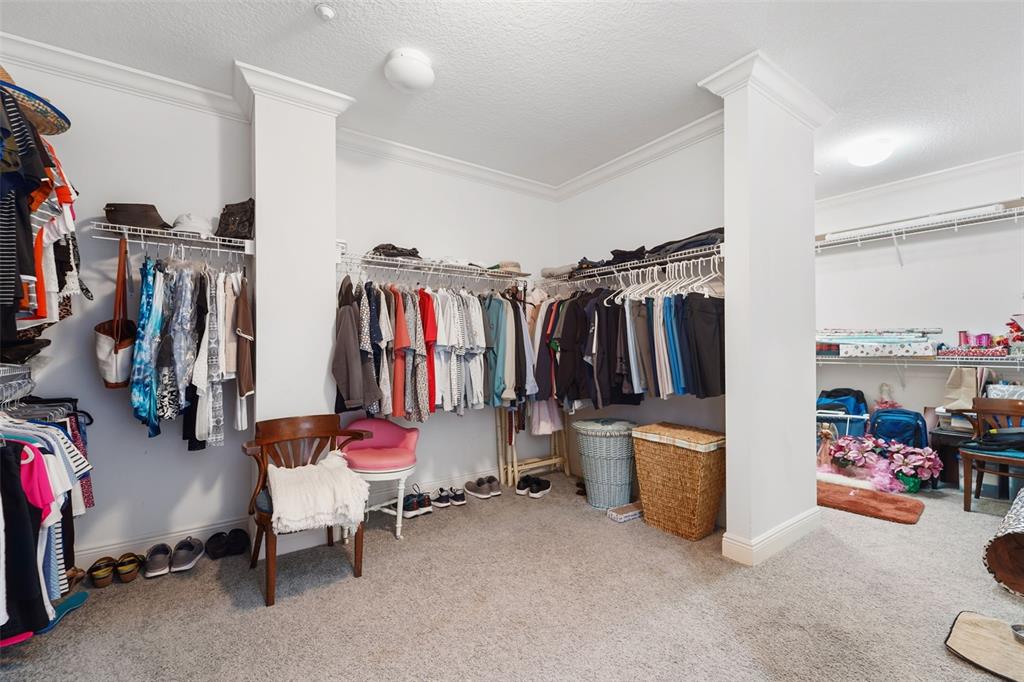 17735 Gulf Boulevard, Unit 702 Redington Shores, FL 33708 - Photo 26 of 60 a view of walk in closet with clothes and shoes