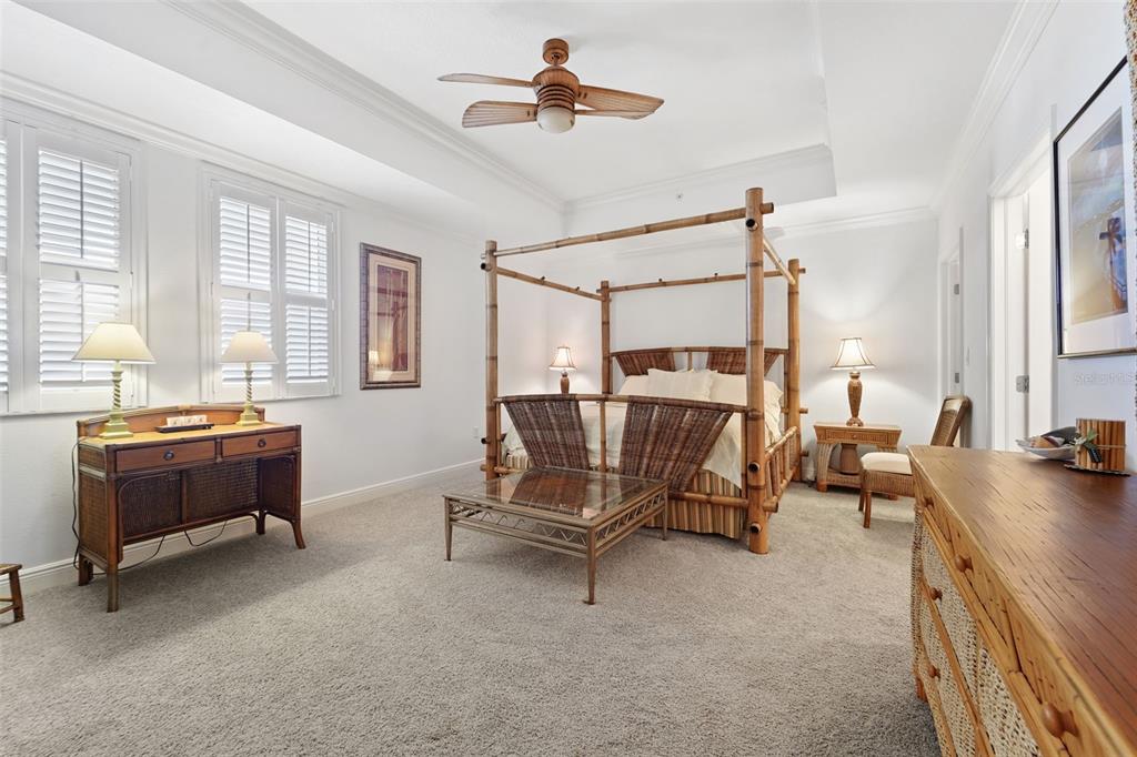 17735 Gulf Boulevard, Unit 702 Redington Shores, FL 33708 - Photo 27 of 60 a living room with furniture and a chandelier