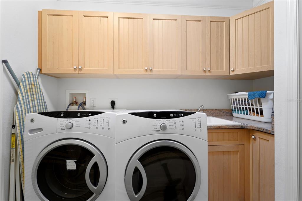 17735 Gulf Boulevard, Unit 702 Redington Shores, FL 33708 - Photo 34 of 60 a utility room with dryer and washer
