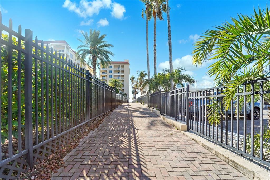 17735 Gulf Boulevard, Unit 702 Redington Shores, FL 33708 - Photo 43 of 60 a view of path along with wooden fence