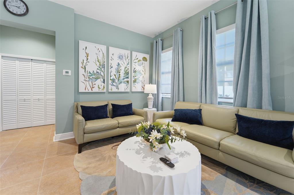 17735 Gulf Boulevard, Unit 702 Redington Shores, FL 33708 - Photo 48 of 60 a living room with furniture and a large window