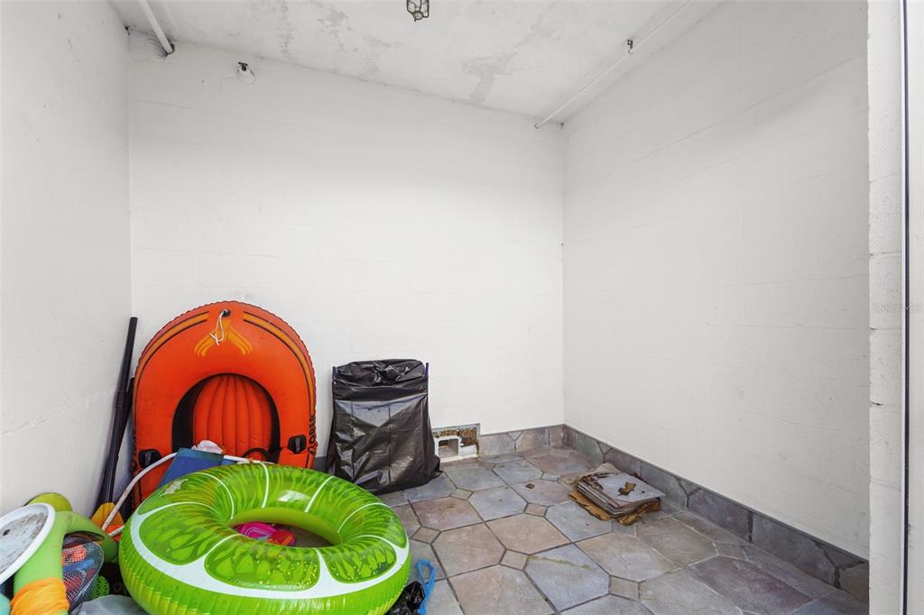 17735 Gulf Boulevard, Unit 702 Redington Shores, FL 33708 - Photo 50 of 60 a room with a stove and a mirror
