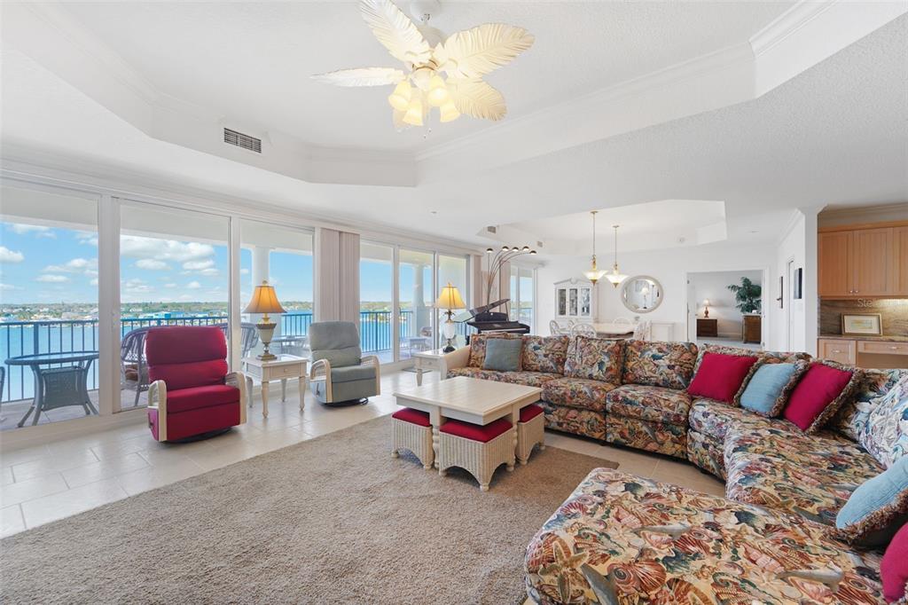 17735 Gulf Boulevard, Unit 702 Redington Shores, FL 33708 - Photo 5 of 60 a living room with furniture or couch and a large window