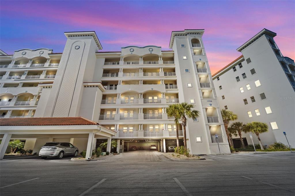 17735 Gulf Boulevard, Unit 702 Redington Shores, FL 33708 - Photo 58 of 60 front view of a building with a street