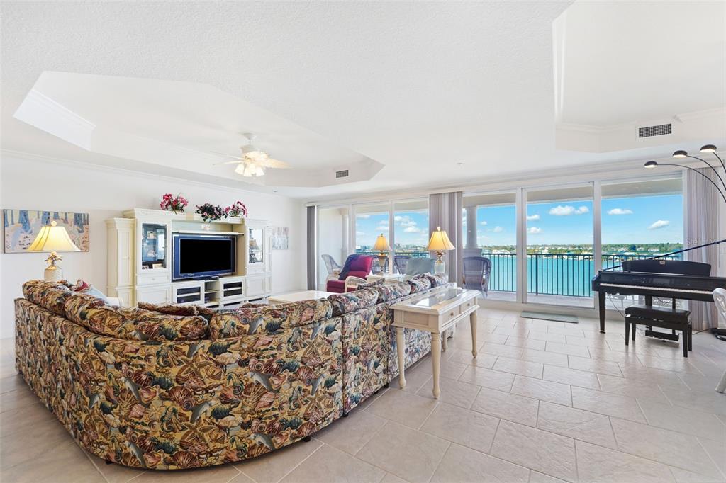 17735 Gulf Boulevard, Unit 702 Redington Shores, FL 33708 - Photo 6 of 60 a living room with furniture and a flat screen tv