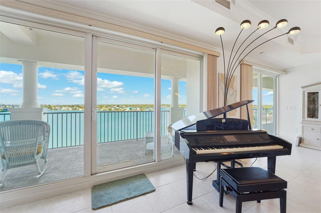 17735 Gulf Boulevard, Unit 702 Redington Shores, FL 33708 - Photo 8 of 60 a view of a workspace room with furniture and floor to ceiling window