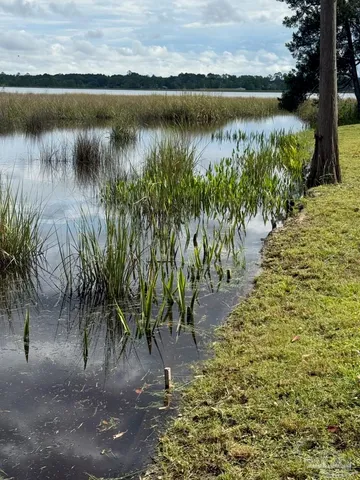 a view of a lake with a big yard