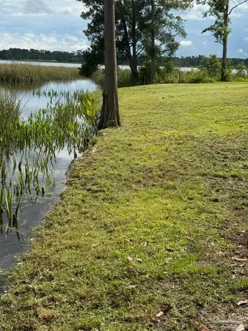 a view of a lake with a building in the background