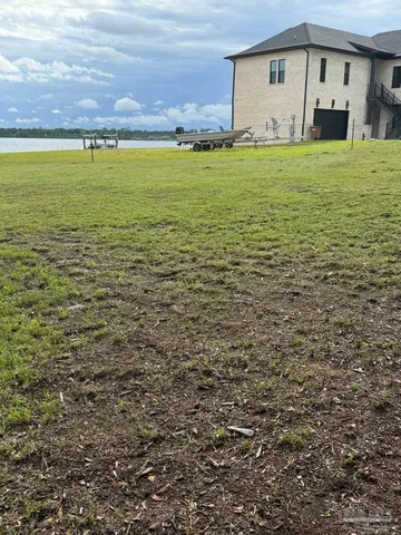 a view of a field with an trees