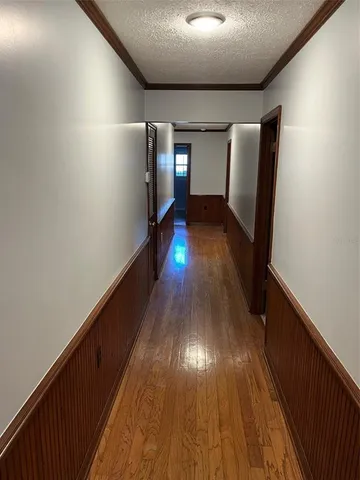 a view of entryway with wooden floor