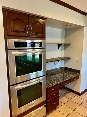 a kitchen with a stove and a microwave