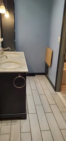 a bathroom with a sink and mirror