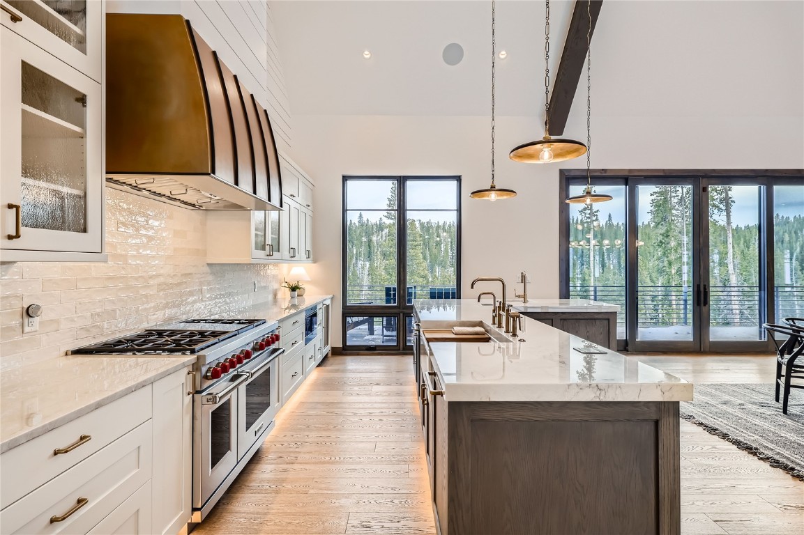 207 Barton Ridge Drive Breckenridge, CO 80424 - Photo 15 of 50 a kitchen with stainless steel appliances a sink a stove and a large window