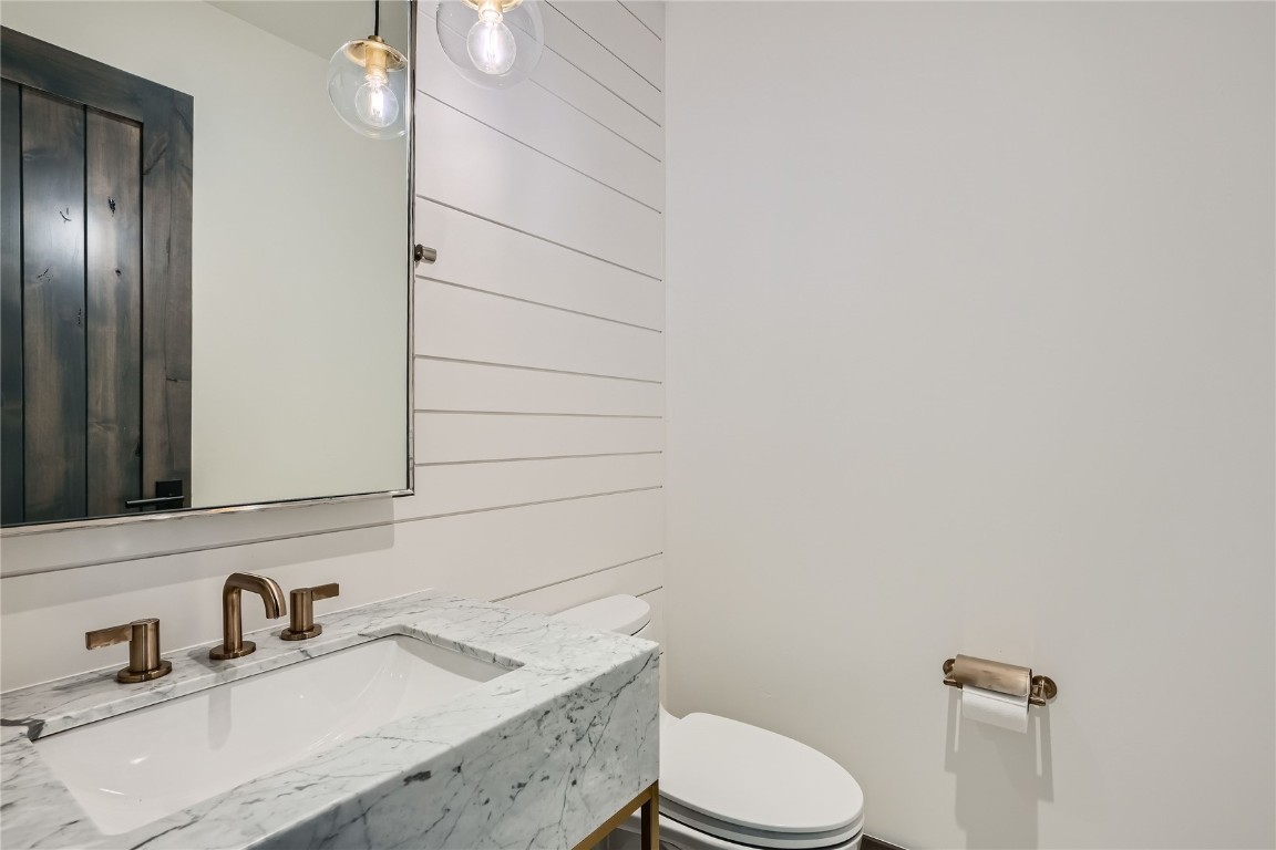 207 Barton Ridge Drive Breckenridge, CO 80424 - Photo 16 of 50 a bathroom with a granite countertop toilet sink and mirror