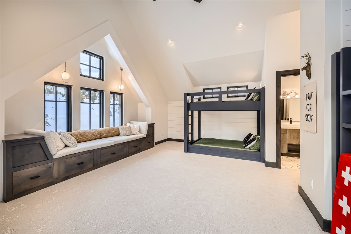 207 Barton Ridge Drive Breckenridge, CO 80424 - Photo 28 of 50 a spacious bedroom with a bed and a television