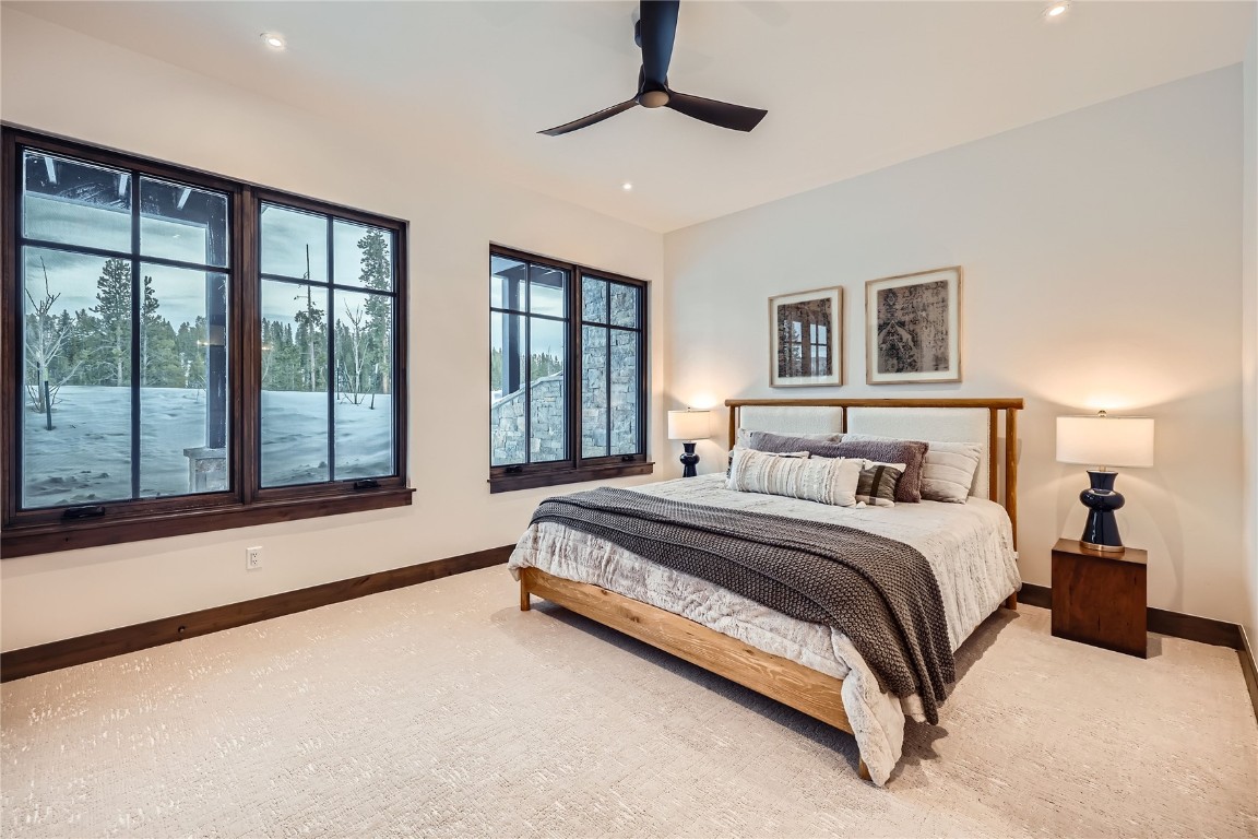 207 Barton Ridge Drive Breckenridge, CO 80424 - Photo 35 of 50 a spacious bedroom with a large bed and a large window