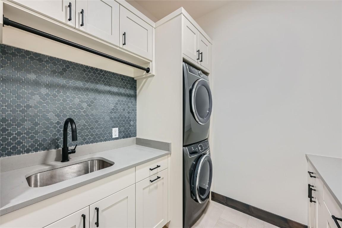 207 Barton Ridge Drive Breckenridge, CO 80424 - Photo 37 of 50 a close view of a sink a washer and dryer
