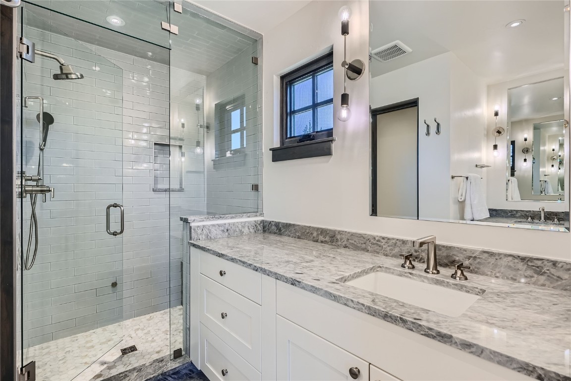 207 Barton Ridge Drive Breckenridge, CO 80424 - Photo 40 of 50 a bathroom with a granite countertop sink mirror and shower
