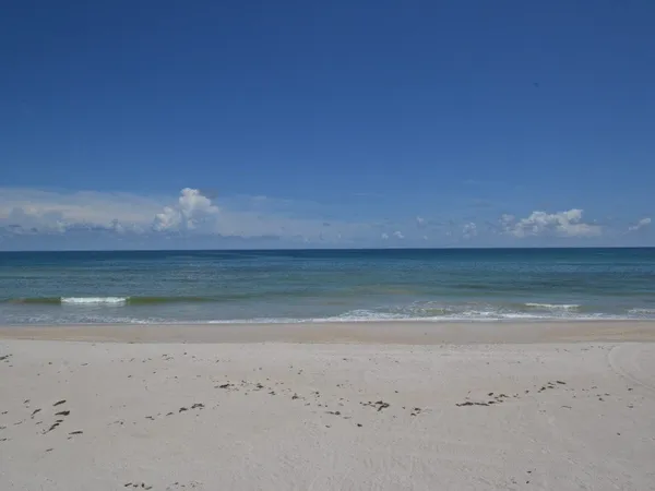 a view of a swimming pool and lounge chair