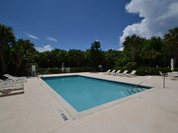 a front view of building with yard