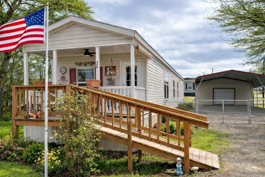 a view of a house with a yard and balcony