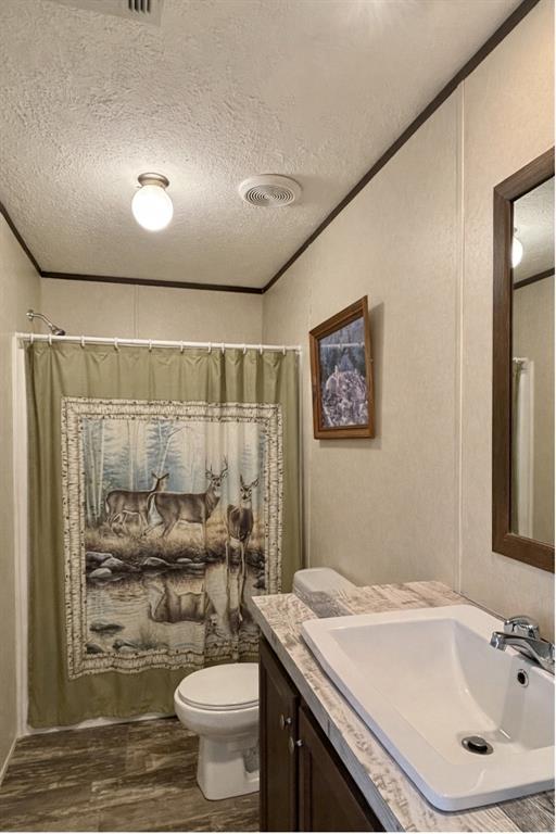 750 Waterfront Row Quitman, TX 75783 - Photo 14 of 32 a bathroom with a sink toilet and shower
